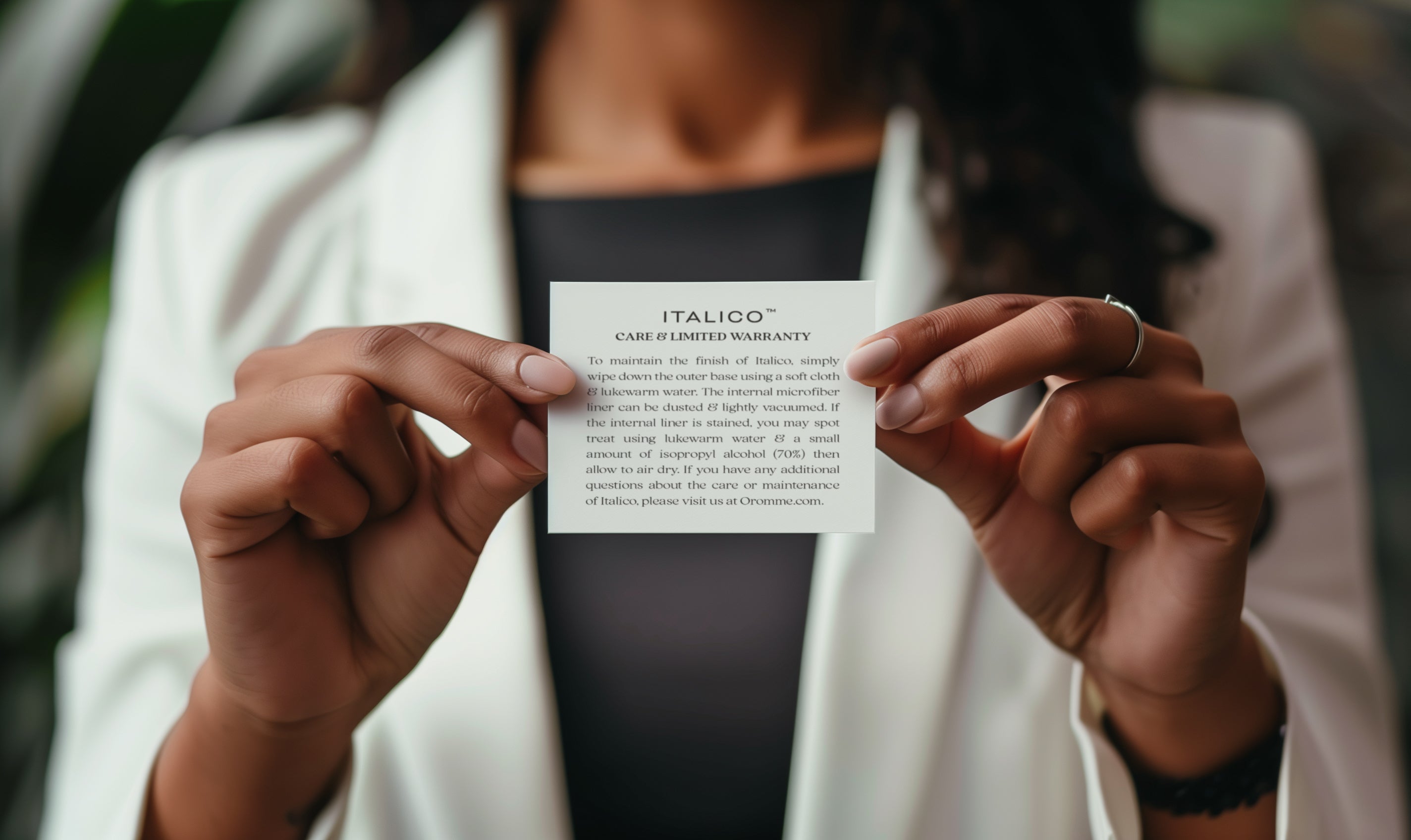 Image of woman holding up product one year limited warranty card