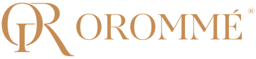Orommé Logo in gold on a large transparent backdrop
