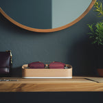 Head On Image of White Maple Italico Luxury Glasses Valet sitting with Dior sunglasses sitting on an entry way foyer table