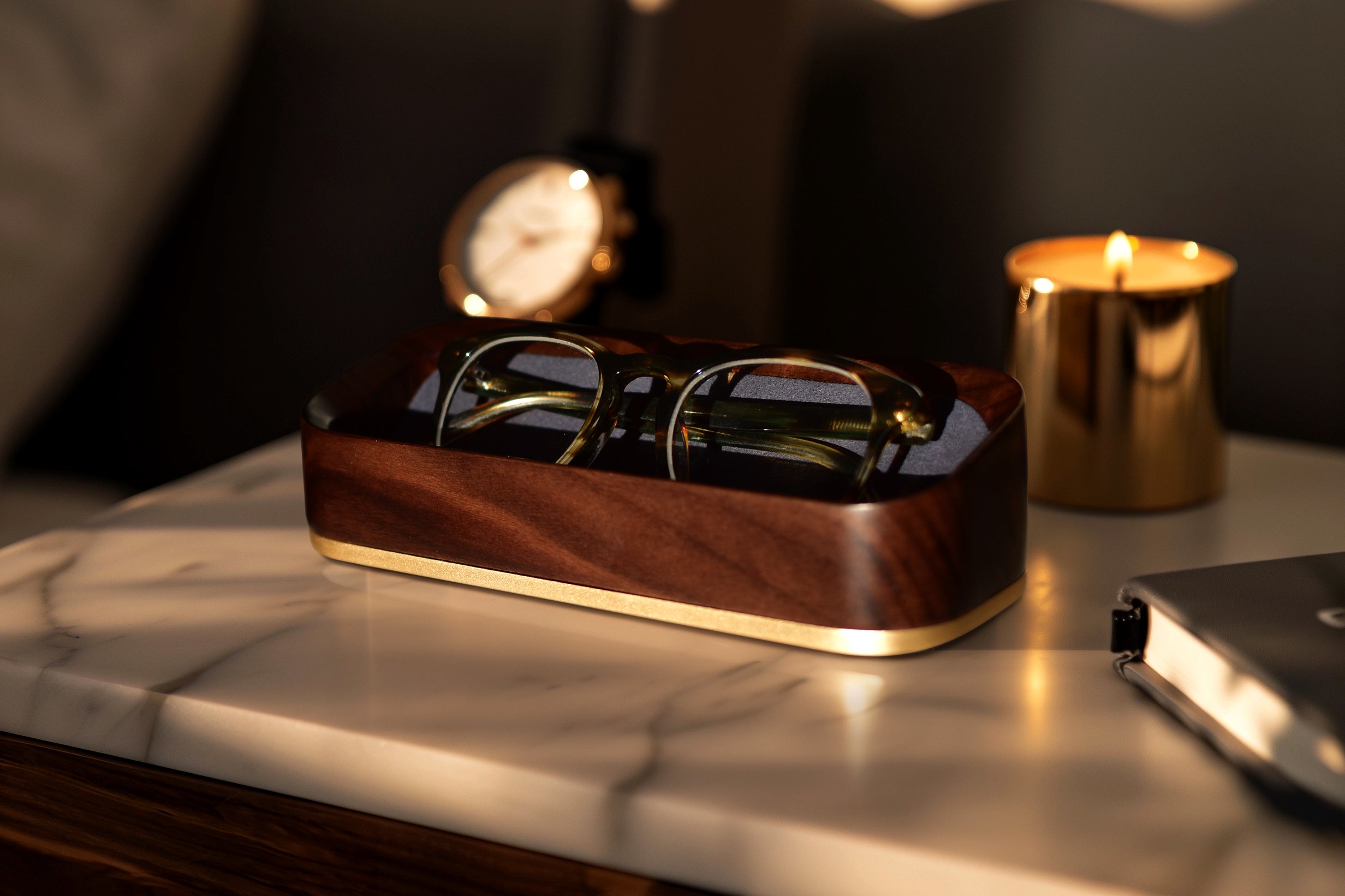Dark Golden Hour Lifestyle Image of Italico Luxury Glasses Valet on a bedside table with glasses nested inside